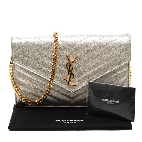 ysl gold monogram clutch|ysl monogram clutch dark beige.